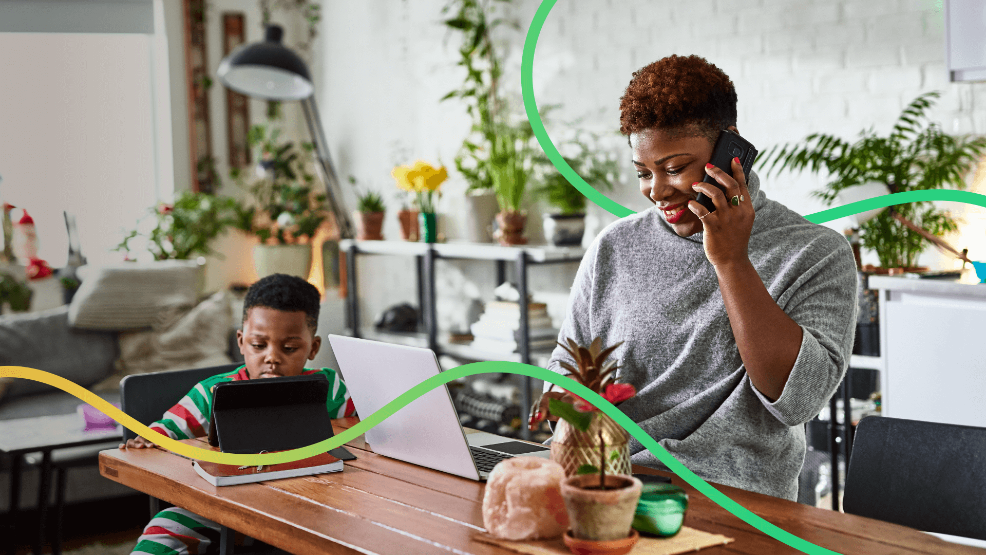 Woman On Mobile Working From Home With Child
