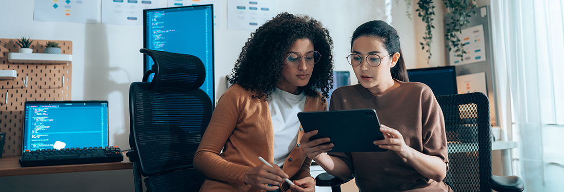 women in review with tablet