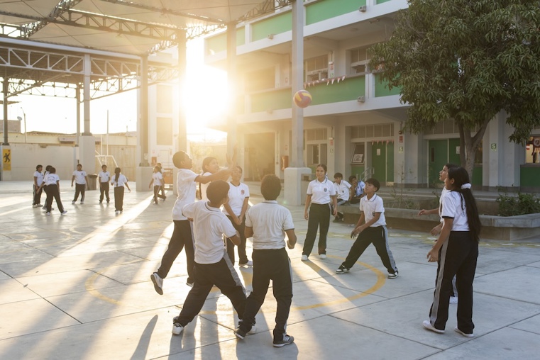 Children playing at sunset