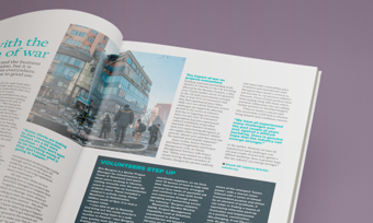 A magazine spread featuring a vibrant photo of diverse individuals engaging on a lively city street.