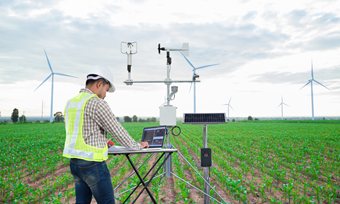 Engineer In Field With Laptop