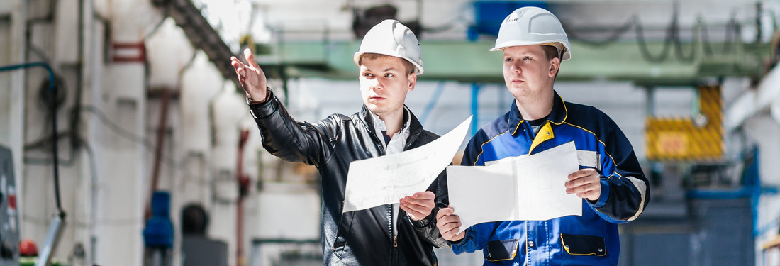 Construction Workers Checking Boards