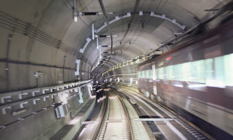 A train moving quickly through an underground tunnel